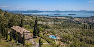 When alex shows his brother the lake house in 2004, he mentions that the house has no way to reach the water and that there should be a staircase so that you could go swimming. Italian Property With Lake Views