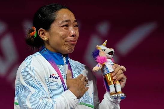 InPics | An emotional Mirabai Chanu fought back tears as the Indian  national anthem played after she clinched gold in the women's 48kg  weightlifting event at the Commonwealth Games 2026 in Glasgow.