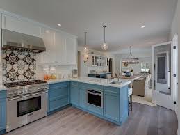 White Top Cabinets And Blue Bottom Cabinets Transitional Kitchen Solid Wood Kitchen Cabinets Kitchen Cabinets Peninsula Kitchen Design