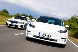 Size will depend on the variant. Tesla Model 3 Vs Bmw 3 Series Electric Car Vs Diesel Showdown Auto Express