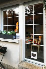 Coplaning S A Weisse Fenstertur Mit Katzenklappe