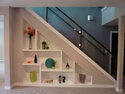 This area provides a perfect book storage solution without having to add extra furniture to other rooms. House Tour Colorful And Modern In Which I Step Into A Real Life Version Of An Ikea Catalog Shelves Under Stairs Understairs Storage Staircase Storage