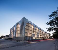 3xn Completes Copenhagen Hospital Building Featuring Slanted Stone Walls Architecture Parking Building Building Facade Garage Pictures