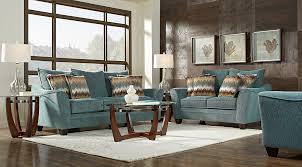 The exposed brick wall gives the living room a lot of character already a welcoming living room with a muted red brick wall, neutral furniture and black touches. Blue White Brown Living Room Furniture Decorating Ideas