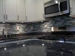 The granite backsplashes give a very neat, clean look to this house that was updated before selling. Small Kitchen In Nyc My Brand New Kitchen Cream Cabinets From Ward Cabinetry Glass Mosaic Ti Trendy Kitchen Backsplash Kitchen Remodel Blue Pearl Granite