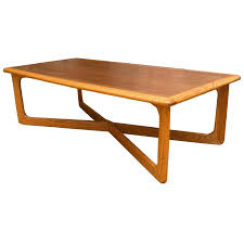 Beautiful and rare design by lane furniture co in the 1950's. Lane Furniture Mid Century Modern Cross Base Coffee Table Aptdeco