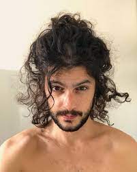 Why not experiment with a demi bun, so that you can still show off the length and texture of your hair? Curly Long Hair 10 Best Hairstyles For Men With Long Curly Hair Atoz Hairstyles