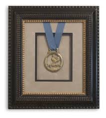 Includes home improvement projects, home repair, kitchen remodeling, plumbing, electrical, painting, real estate, and decorating. A Framed Medal And Ribbon Done Up In Style With A Closed Corner Custom Frame And Suede Matting Custom Picture Frame Frame Frame Shop