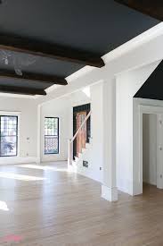 How To Whitewash Hardwood Flooring A Peek At Our 1905 Home Restoration Journey And How We W In 2020 Whitewashed Hardwood Flooring Red Oak Floors Oak Floor Living Room