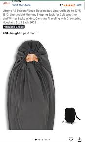 Would an adult sleeping back kept below the waist be a suffocation risk for  a 6 month old?? They maybe one with a drawstring so you can make sure it  doesn't get