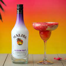 The already tropical malibu has been given a fruity kick in this passion fruit expression! Passion Fruit Raspberry Daiquiri Rum Drinks Recipes Fruit Cocktails Malibu Rum Drinks