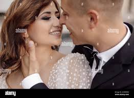 Receives a kiss from his wife hi-res stock photography and images