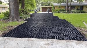 Bands add decoration and can be made of concrete, colored concrete, brick, or stone. Driveway Water Control Eco Friendly Solution To Driveway Drainage Problems Truegrid Pavers