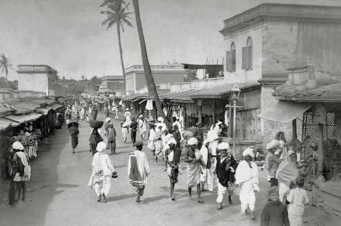 An old photographic image of an English 'memsahib' with some Indian ladies, British India, circa late 19th century. Can anyone please identify the location more precisely? Somebody told me it could be