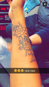 Lotus Flower Tattoo To Represent A New Beginning Flower Wrist Tattoos Tattoos Vine Tattoos