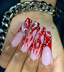 Suzie has fun creating a stunning set of red hot flaming nails. Sn Zfxive2bz8m