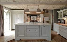 French grey panels are paired with marble counters and that rise up to the backsplash. Things We Love Natural Ceilings Design Chic Grey Kitchen Island Light Grey Kitchens Kitchen Cabinet Colors