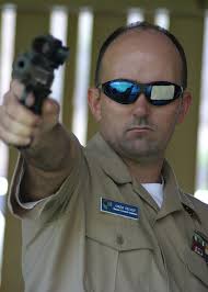 File:US Navy 031007-N-5539C-001 Electronics Technician Senior Chief Greg  Silvey assigned to Submarine Squadron Three, demonstrates another near  perfect shot at the already battered silhouette target.jpg