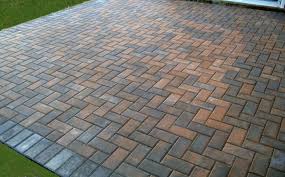 Cypress (wire cut) paving brick using a herringbone pattern and bordered with flagstone to tie patio together with informal walk, and help restrain the brick. Brick Patio Columbus Oh Wilson S Landscaping Services