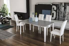 The convenient extendable table features a metal base and unique white glass top. Extendable Table Glass Suitable For Dining Rooms Modern Idfdesign