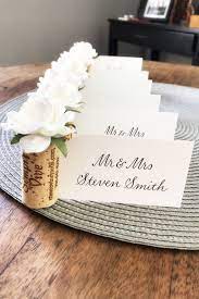 Using watercolours as a decoration makes wedding place cards look a lot more refined in a creative way. Wedding Place Card Holder Place Card Holders Wedding Wedding Place Cards Rose Place Card Holders