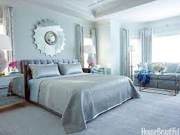 Pendant lights frame the bed, and the large blue area rug adds warmth to the wood floor. Glamorous Blue Decor Bedroom Colors Bedroom Color Schemes Blue Bedroom