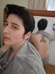 Another photo cos i am in love with this triskele tattoo- (It is the right  way around