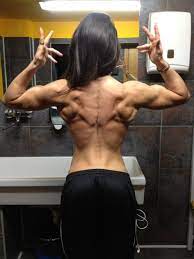 Keep your back straight and slowly lower your chest to the ground. Muscle Definition Back Female Fitness Body Muscle Women Fitness Inspiration