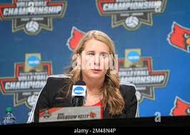 In the NCAA Volleyball Championship, Louisville, coached by two former  Nebraska volleyball head coaches, took