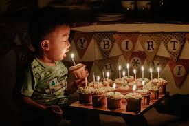 Parent dad hold child hand. Boy Holding Cupcake Blowing The Candle Photo Free Candle Image On Unsplash