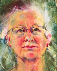 Me sat with my self portrait Oil pastels