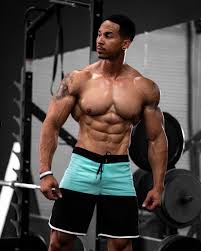 You can flip through a magazine to decide what hairstyle you want, and now you can do the same for your dream body! Mens Physique Board Shorts An Inspired Dedicated Gym Trainer Prepares For Competition The Menswear Newsletter