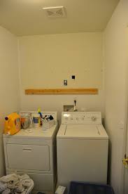 A washer and dryer pedestal contributes to better ergonomics and can prevent back pain caused by having to bend over while. Small Laundry Room And Bathroom Makeover Week 1 One Room Challenge Sisters What