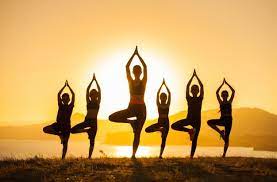 Group Of Children Are Engaged In Yoga With A Trainer On The Ocean Aerial Yoga Yoga At Home Yin Yoga