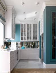 You can look at the reflective side of the backsplash as it mirrors the walls of the kitchen when the light is on. 75 Beautiful Kitchen With White Cabinets And Mirror Backsplash Pictures Ideas July 2021 Houzz