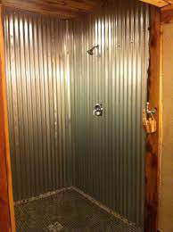 Aluminium and metal signs can offer an industrial vibe to a room, while wooden or slate variants complement a rustic theme. Tin Showers Barn Tin Shower Block House Barn For The Home Tin Shower Walls Rustic Bathrooms Metal Shower Walls