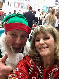 Student services coordinator Kim Pepin (as Leon the Elf) with band director  Laura Robinson getting ready for the EJHS Band's Holiday Collage concert.  👍🏻🎼