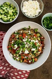 The juice and the zest from one fresh lemon, some fresh chopped. Greek Couscous Salad