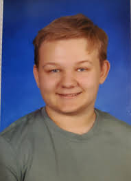 I wonder if anyone could adjust this picture of my Grandson. He is going to  be 15 soon & I would like to give him a framed picture of this photograph  for