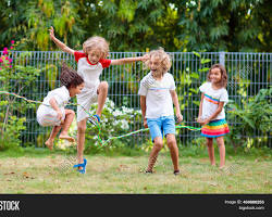 children playing happily in a parkの画像