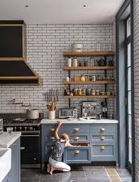The green trim around the conveniently placed kitchen window and matching decor, dishes, and extra pops of color add a touch of contemporary to an otherwise simple kitchen. Blue And White Kitchen Decor Inspiration 40 Gorgeous Ideas Now Hello Lovely