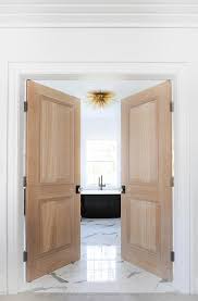 A butter knife is an easily accessible tool when you're outside of the bathroom. White Double Bathroom Doors Design Ideas