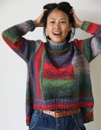 •the arm cutouts add a little edge to this piece. High Low Pullover