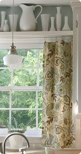 I love the farmhouse lanterns and eat lettering above these kitchen cupboards! Curtain And Shelf Above Kitchen Window Idea For Above Kitchen Doors Home Decor Home Kitchen Sink Window