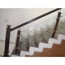 Glass staircase enclosures serve as a stylish addition to modern and minimalist interiors. Glass Wooden Railing Designs For Stairs