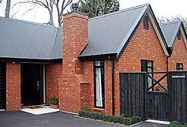 Black window frames can serve as bold accent points, underscoring the rest of your home's aesthetics. Canterbury Clay Bricks Proudly Made In New Zealand Red Brick House Exterior Metal Roof Houses Brick Ranch Houses