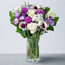Our purple flowers are overflowing with purple roses, carnations, lilies and more! Arrangement Of White N Purple Flowers Uk Gift Arrangement Of White N Purple Flowers Ferns N Petals