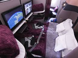 Also, the purple seat colors and wood accents feel very classy. Qatar Airways Luxurious Business Class With Double Beds