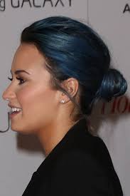 Her hair is currently brown and short. Demi Lovato Straight Blue Bun Hairstyle Steal Her Style