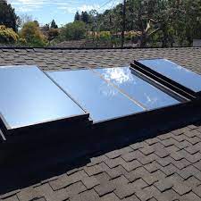 Vented skylights —also called roof windows— are available in both manual and powered styles, and work well in areas like bathrooms that often experience high moisture. Skylight Windows Tinted Reflection Of The Sky And The Customers Inside Are Not Baking Under The Intense Heat Windowfilm Window Film Skylight Window Skylight